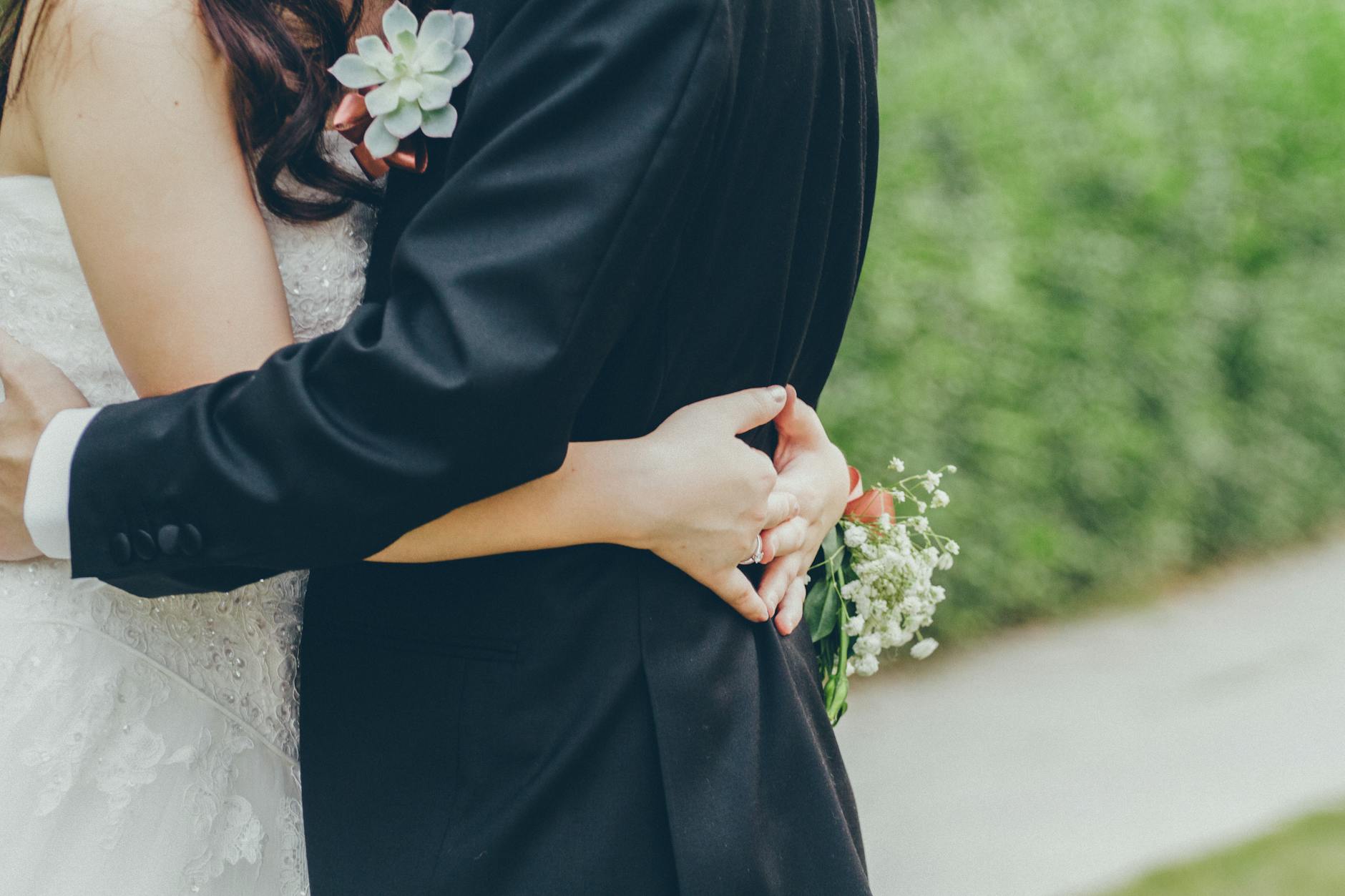 photo of bride and groomhugging